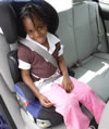 Child in Booster seat with belts